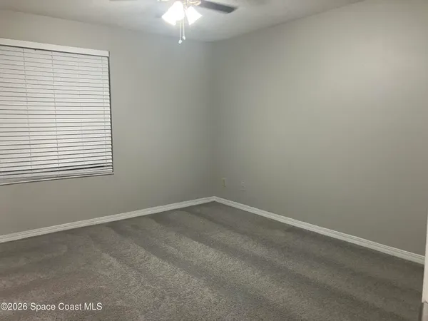 a view of a room that has a window in it