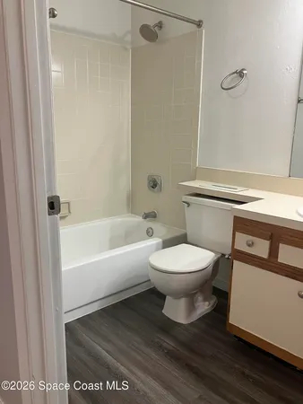 a kitchen with a stove a sink and a microwave