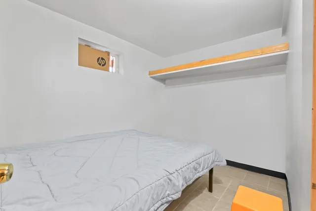 a view of a room with a bed