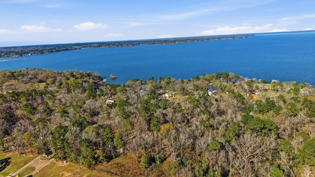a view of a large body of water with a building in the background