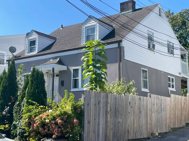 front view of a house with a garden