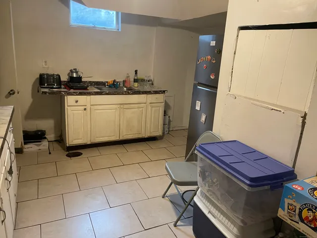a utility room with sink dryer and washer