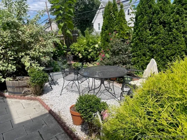 a front view of a house with plants