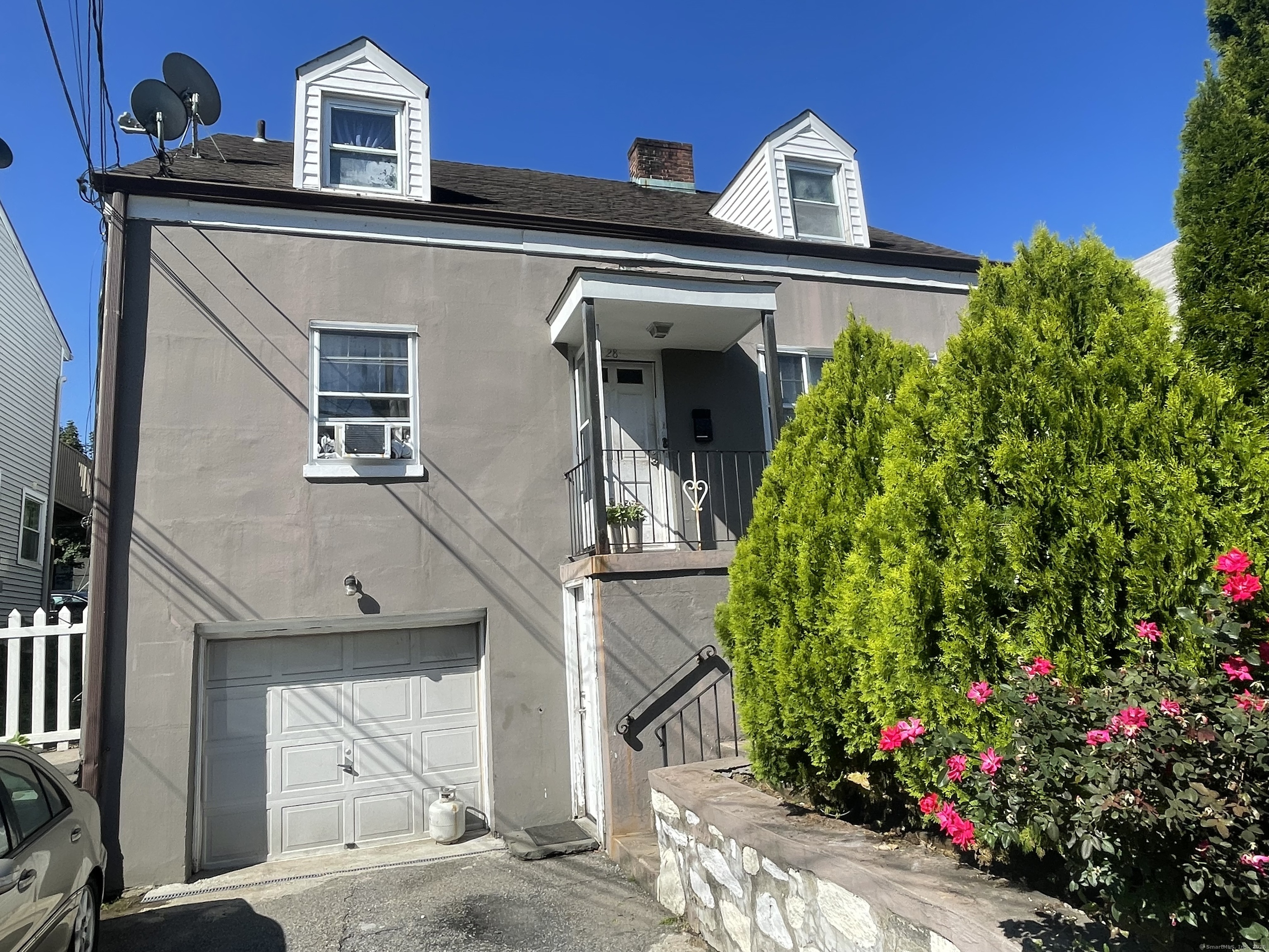 28 Anderson Street Stamford, CT 06902 - Photo 19 of 19 a front view of a house with plants
