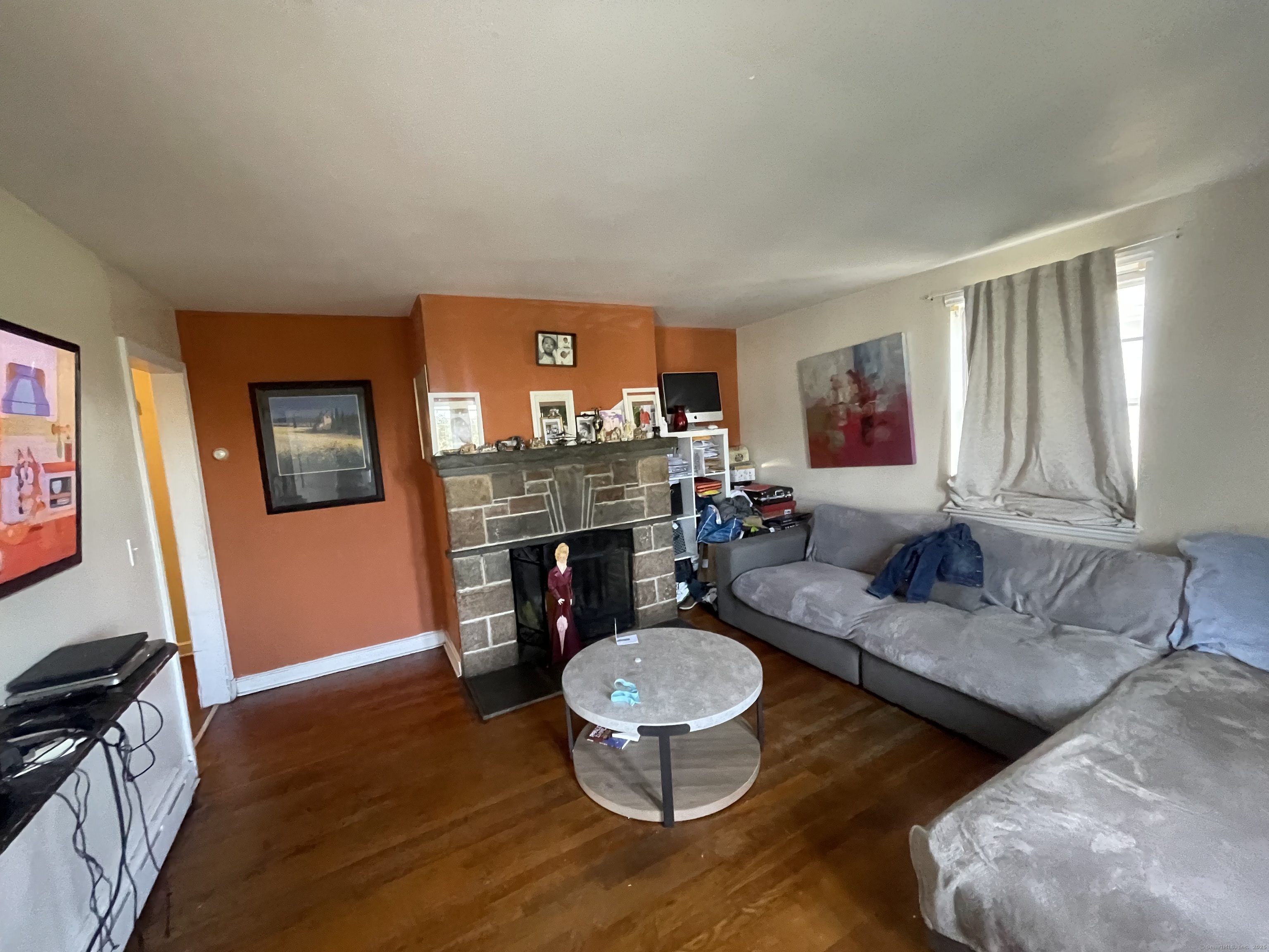 28 Anderson Street Stamford, CT 06902 - Photo 4 of 19 a living room with furniture and a fireplace