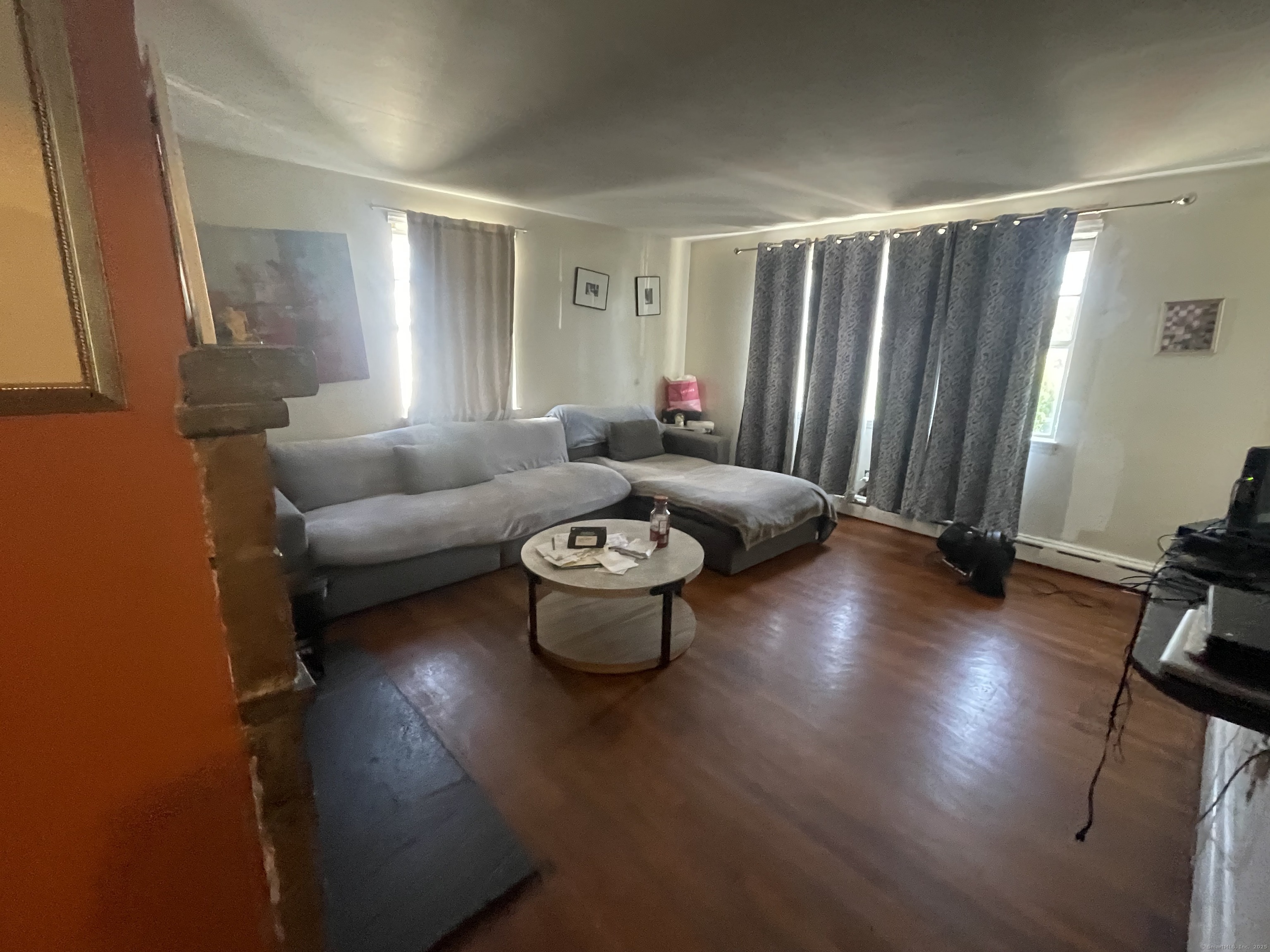 28 Anderson Street Stamford, CT 06902 - Photo 6 of 19 a living room with furniture and a wooden floor