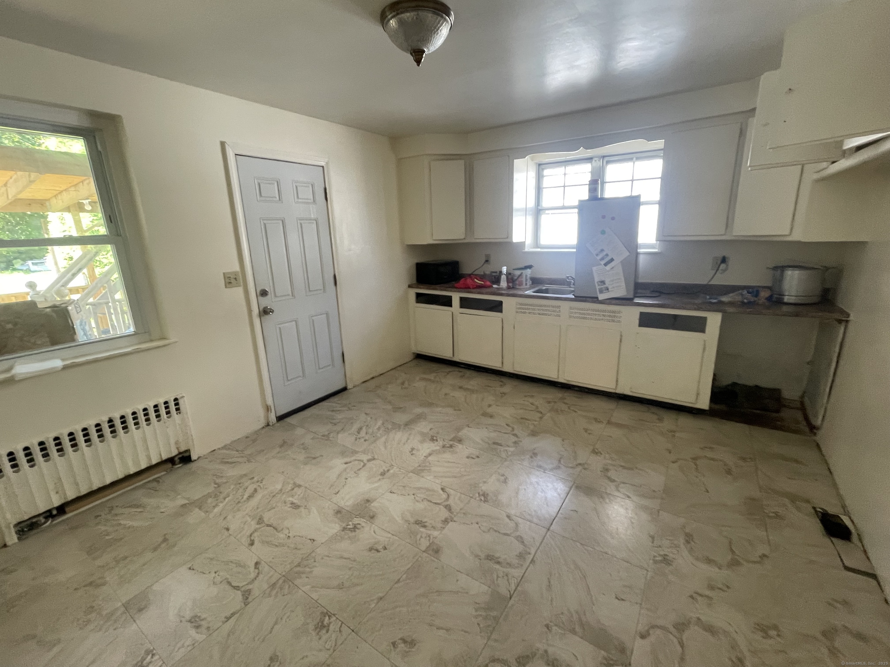 28 Anderson Street Stamford, CT 06902 - Photo 8 of 19 a kitchen with a refrigerator and window