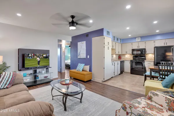a living room with furniture and a flat screen tv