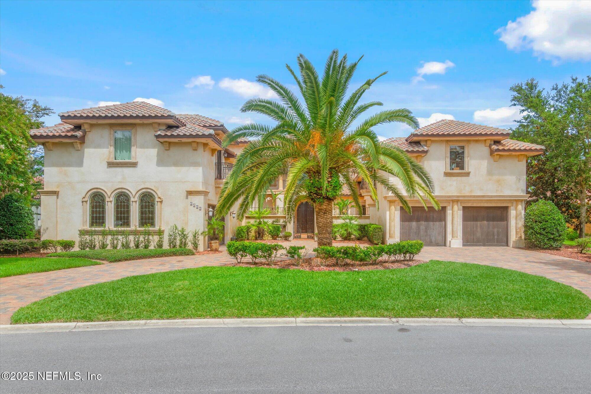 a front view of house with yard and green space