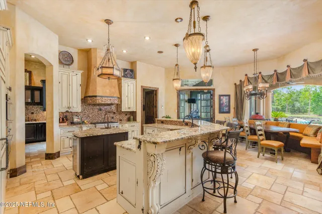 a view of a hallway with wooden floor and furniture