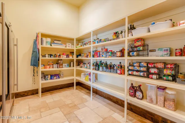 a bathroom with a granite countertop sink a toilet a mirror and shower