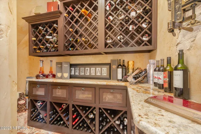 a living room with furniture flat screen tv and a large window