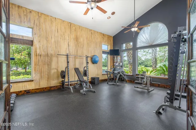 a bathroom with a granite countertop toilet sink and mirror