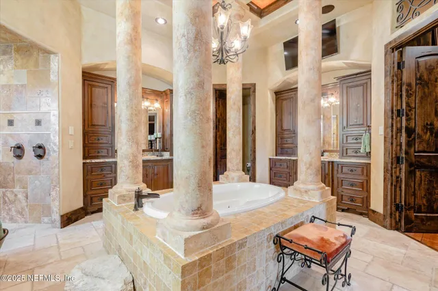 a outdoor space with patio the couches and a fireplace with the potted plants