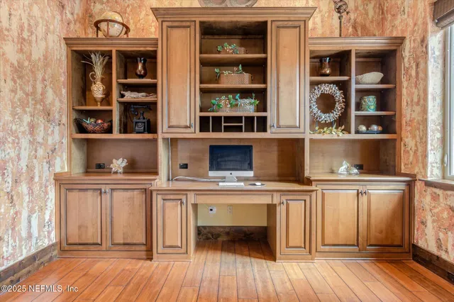 a view of a lake in between two of trees