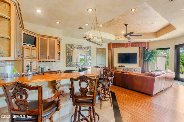 an aerial view of a house with a yard and lake view