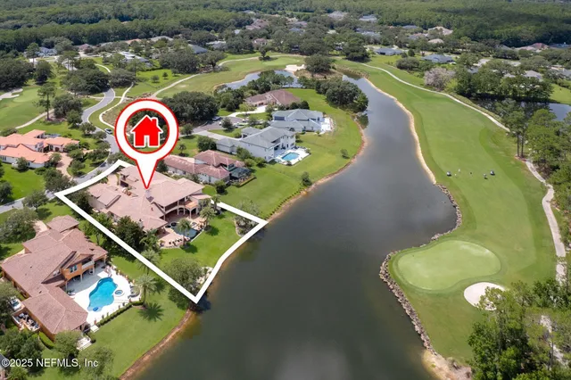 a living room with fireplace furniture and a large window