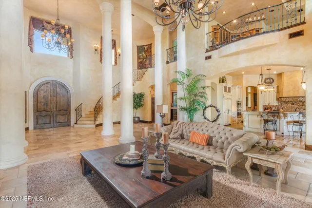 a view of a dining room with furniture wooden floor and a chandelier