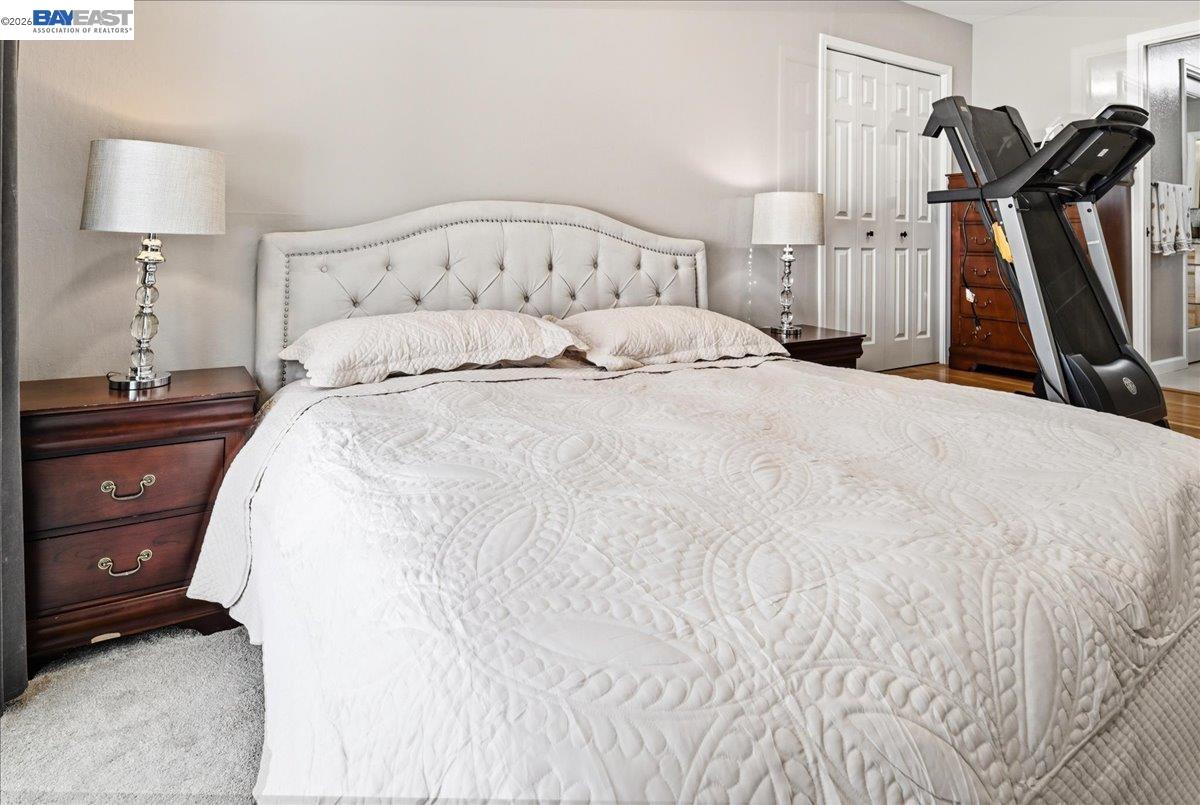 2861 Millbridge Place San Ramon, CA 94583 - Photo 28 of 58 a large bed sitting in a bedroom and a lamp