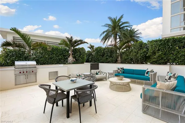 a view of a chairs and table in the patio