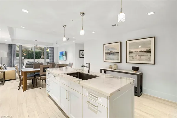 a kitchen with stainless steel appliances granite countertop a stove and a sink