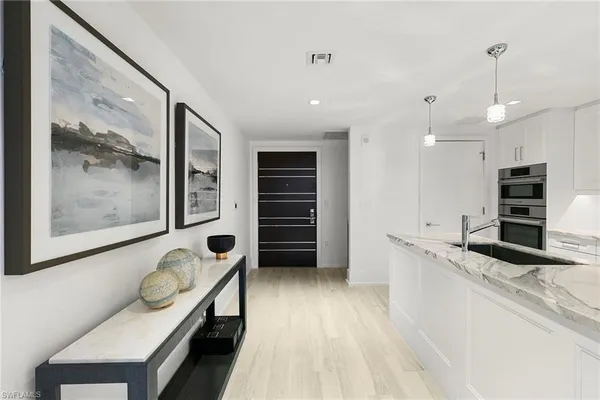 a kitchen with stainless steel appliances granite countertop a stove and a refrigerator
