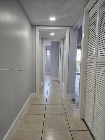 a kitchen with stainless steel appliances a refrigerator sink and cabinets