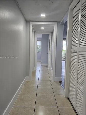 a kitchen with stainless steel appliances a refrigerator sink and cabinets