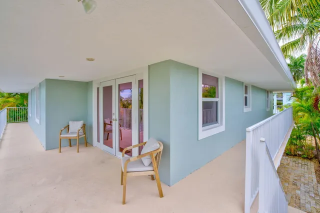 a view of a house with outdoor seating space