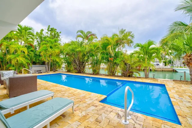 a view of swimming pool with seating space