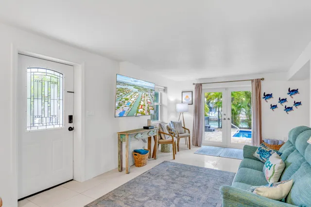 a view of a livingroom with furniture wooden floor and a window