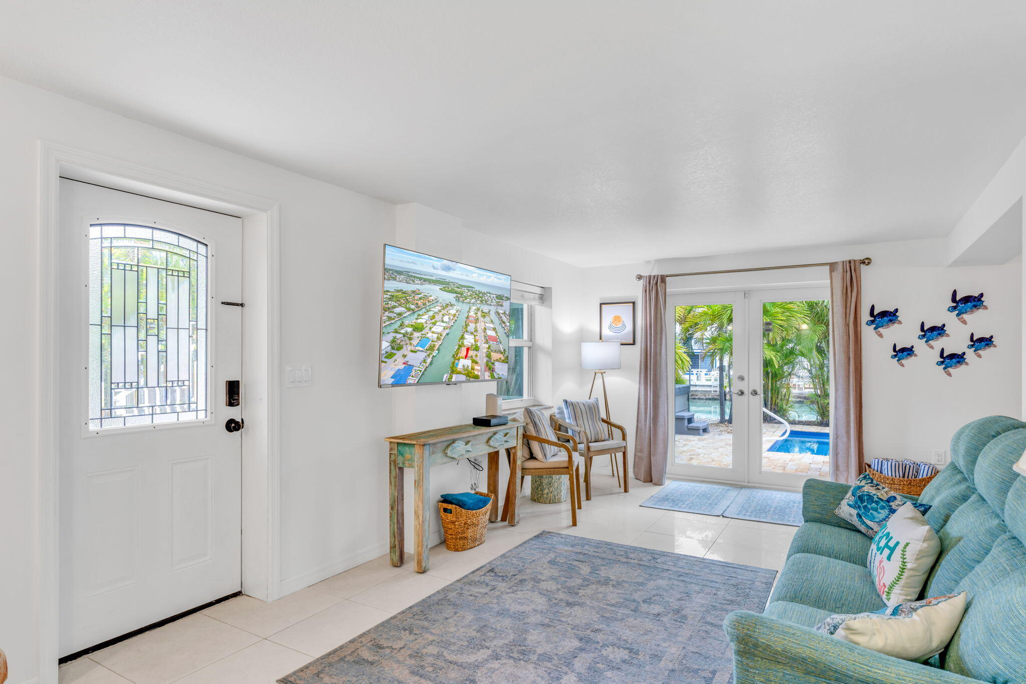 581 10th Street Key Colony Beach, FL 33051 - Photo 32 of 50 a view of a livingroom with furniture wooden floor and a window