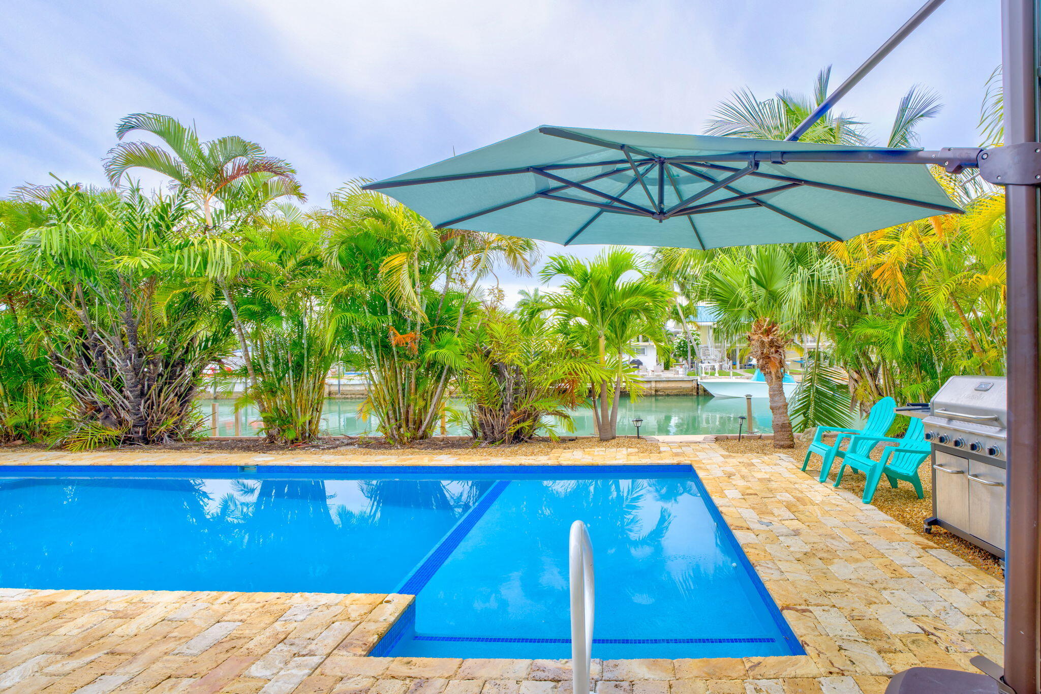 581 10th Street Key Colony Beach, FL 33051 - Photo 36 of 50 a view of swimming pool with a lounge chairs