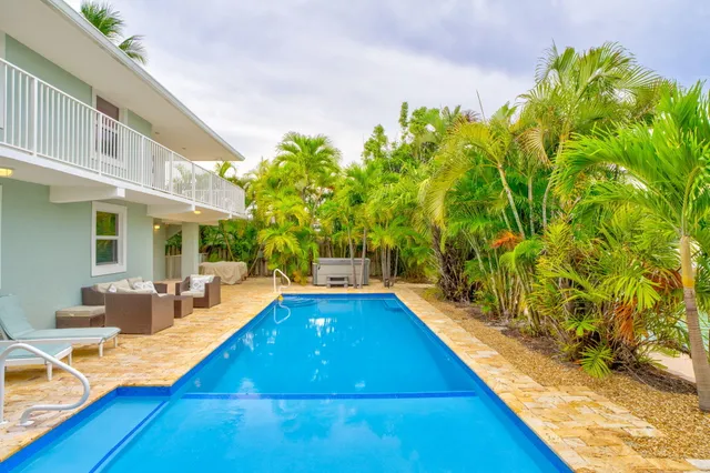 a view of swimming pool with chairs
