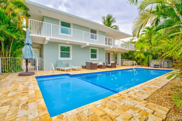 a view of swimming pool with outdoor seating