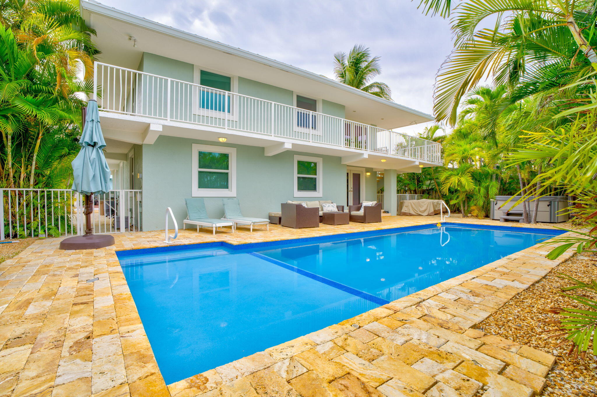581 10th Street Key Colony Beach, FL 33051 - Photo 39 of 50 a view of swimming pool with outdoor seating