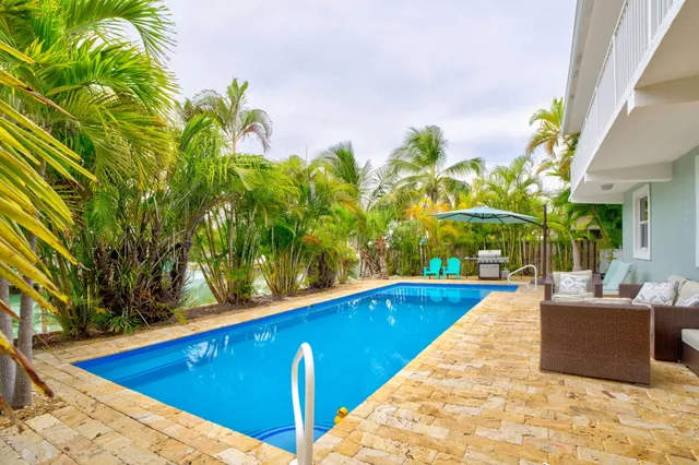 a view of a swimming pool with an outdoor seating