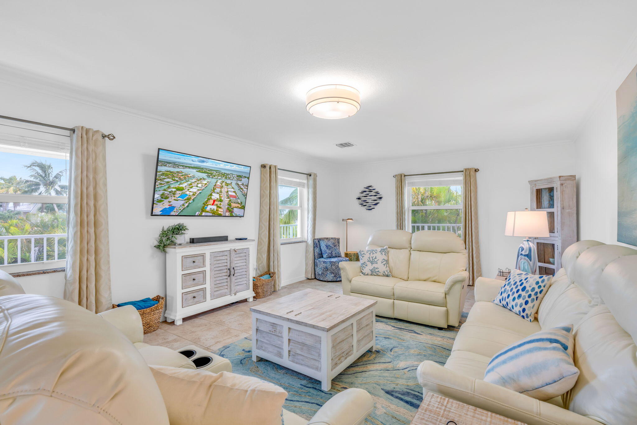 581 10th Street Key Colony Beach, FL 33051 - Photo 4 of 50 a living room with furniture and a flat screen tv