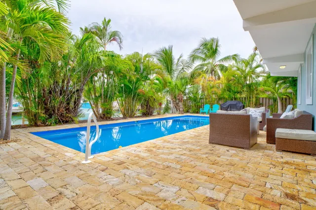 a view of a swimming pool with a patio