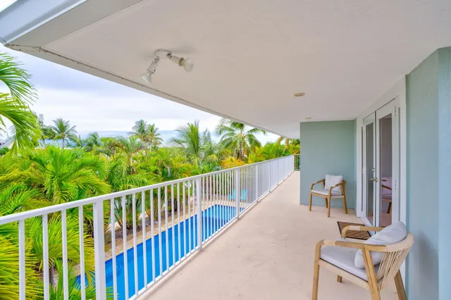 a view of balcony with furniture