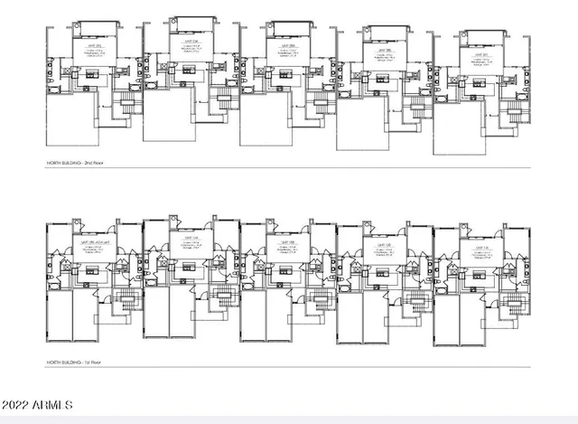 a black and white photo of a swimming pool