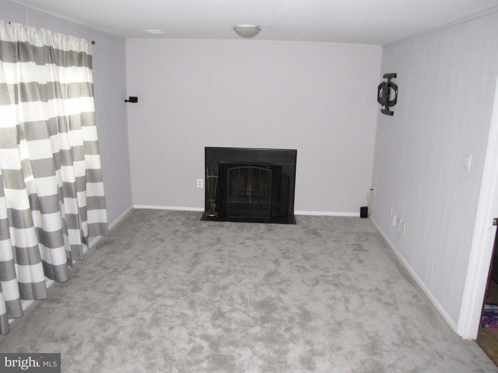 9600 Farewell Road Columbia, MD 21045 - Photo 12 of 18 a view of an empty room with a fireplace