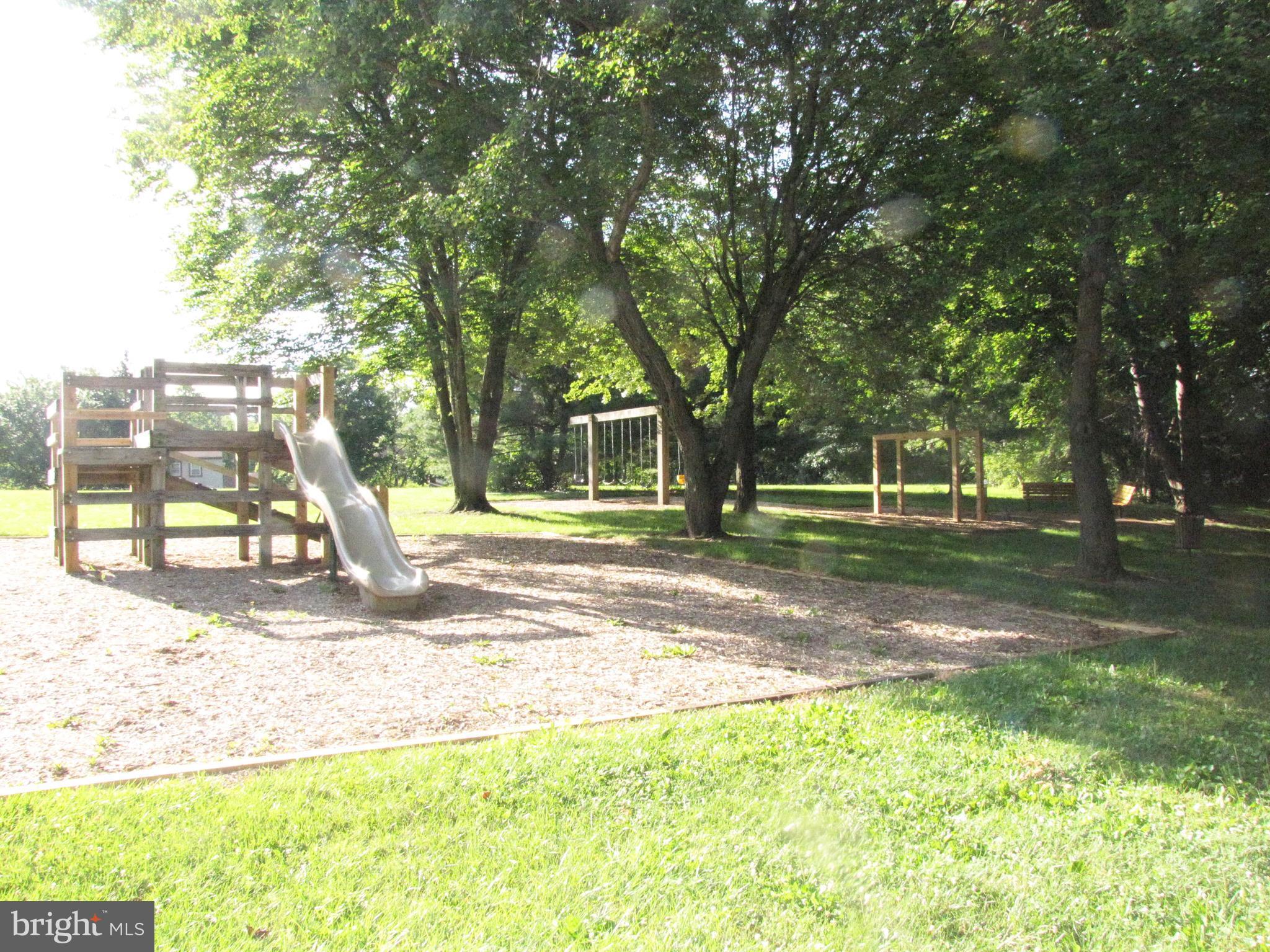 9600 Farewell Road Columbia, MD 21045 - Photo 17 of 18 a view of a park with swings and slides