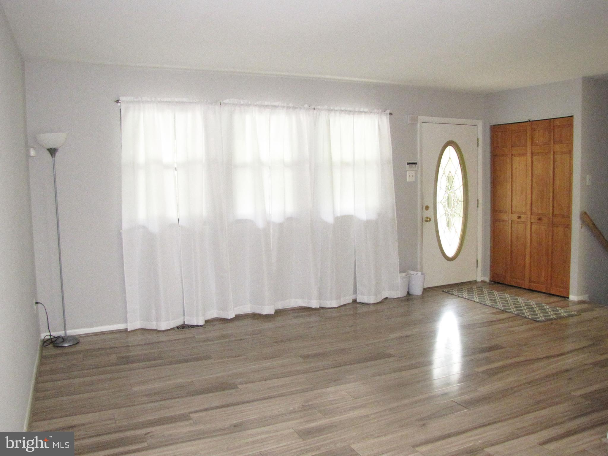 9600 Farewell Road Columbia, MD 21045 - Photo 3 of 18 a view of a room with wooden floor and window