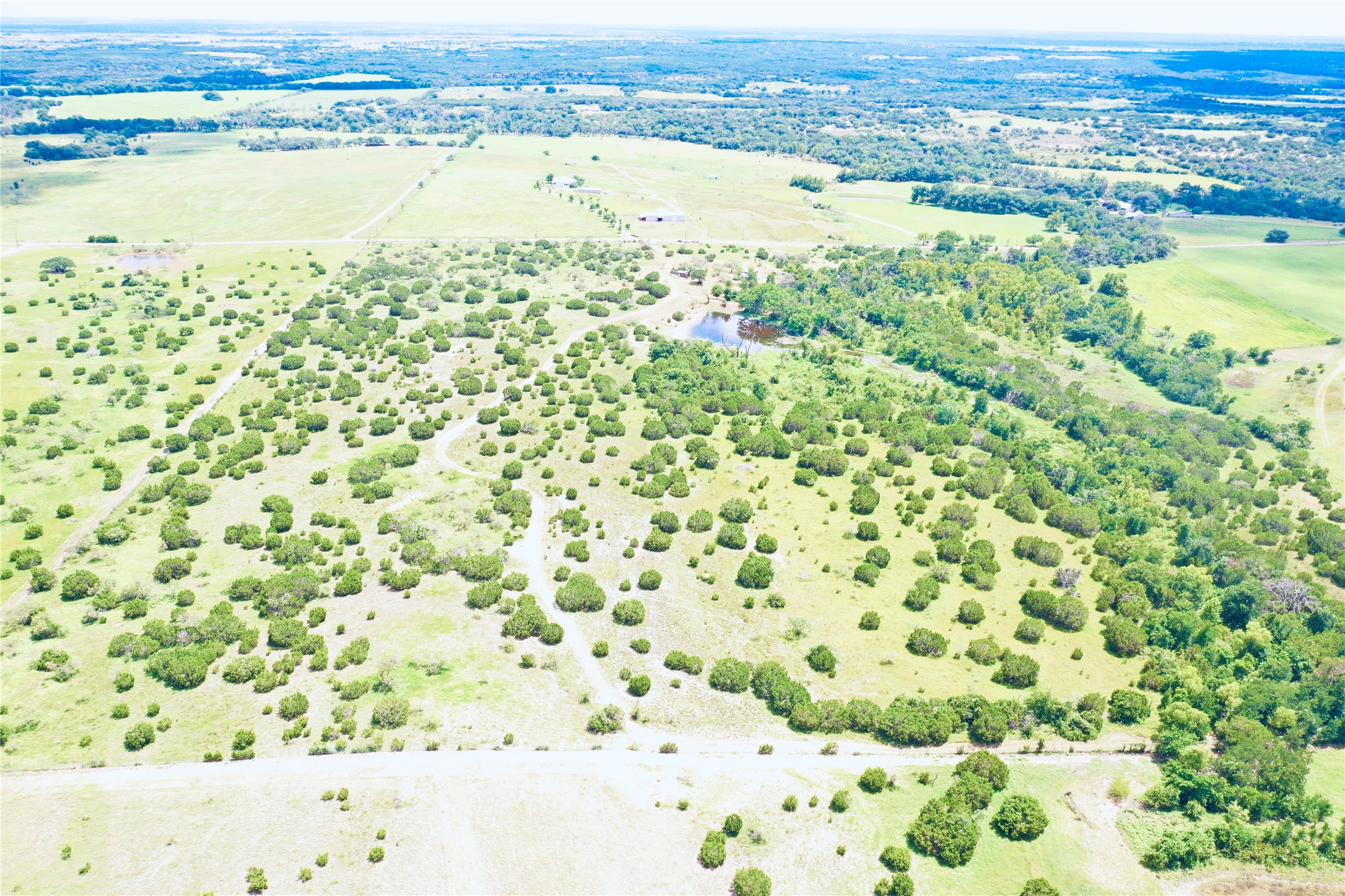 210 Rd Bertram Tx 78605 Road Bertram, TX 78605 - Photo 5 of 5 The 18.99 acre tract is on the left side of this photo.