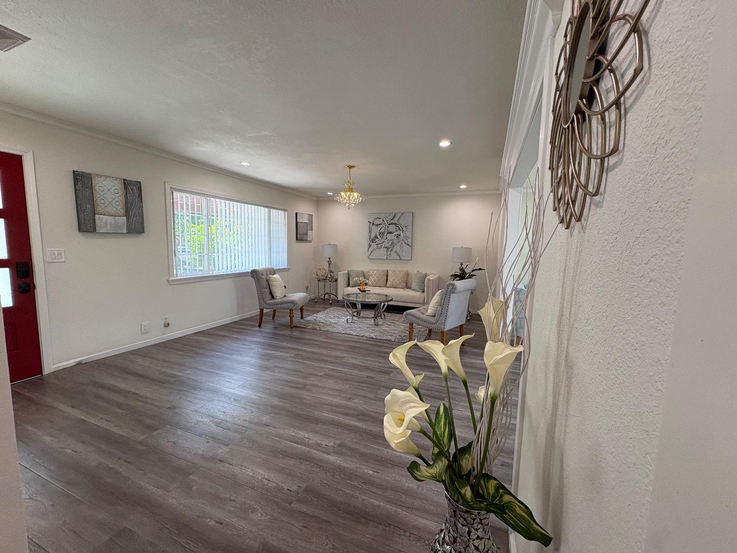 5187 Doyle Road San Jose, CA 95129 - Photo 6 of 39 a living room with furniture windows and a wooden floor
