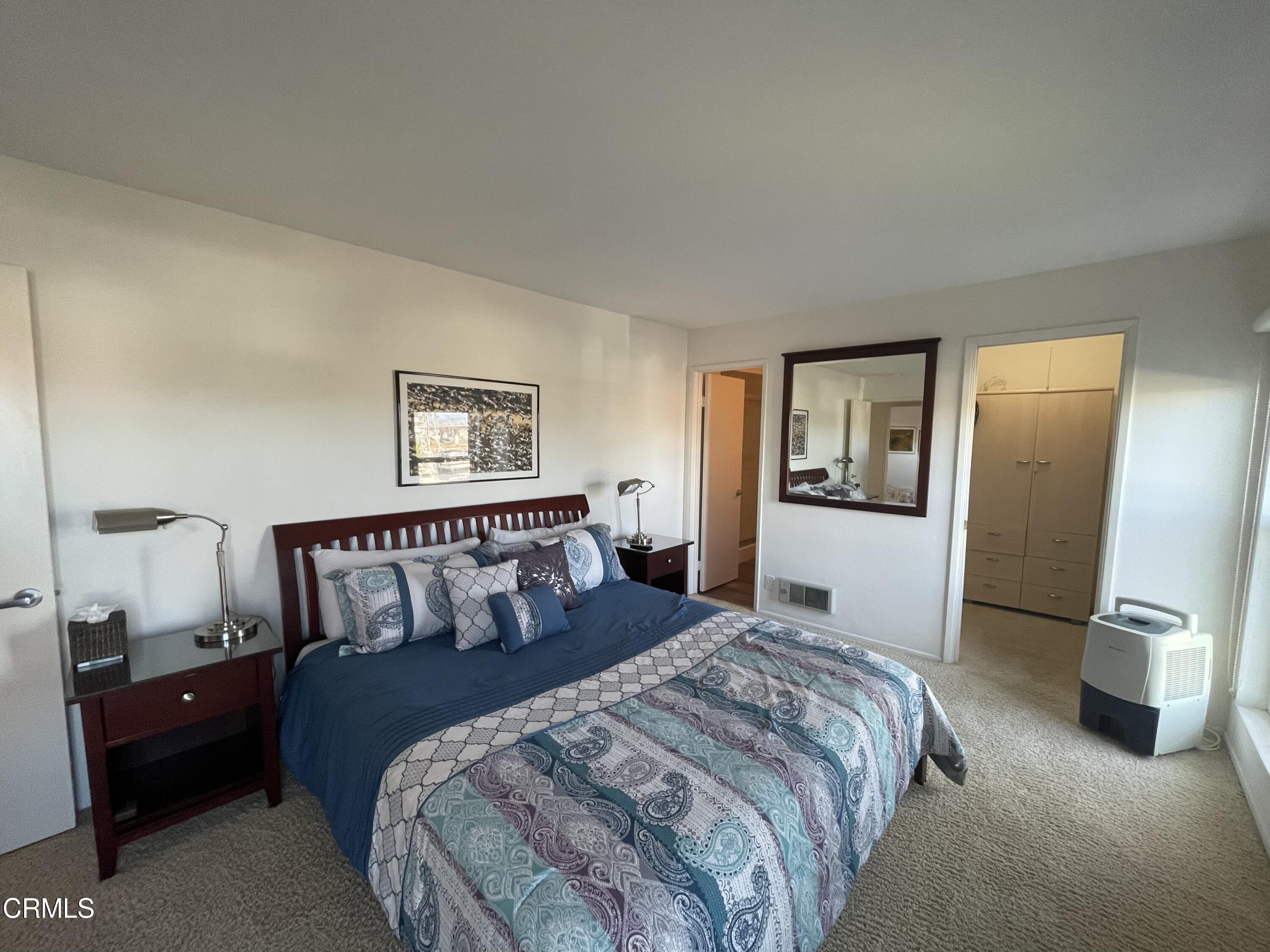 2901 Peninsula Road, Unit 144 Oxnard, CA 93035 - Photo 11 of 25 a bedroom with a large bed and a window