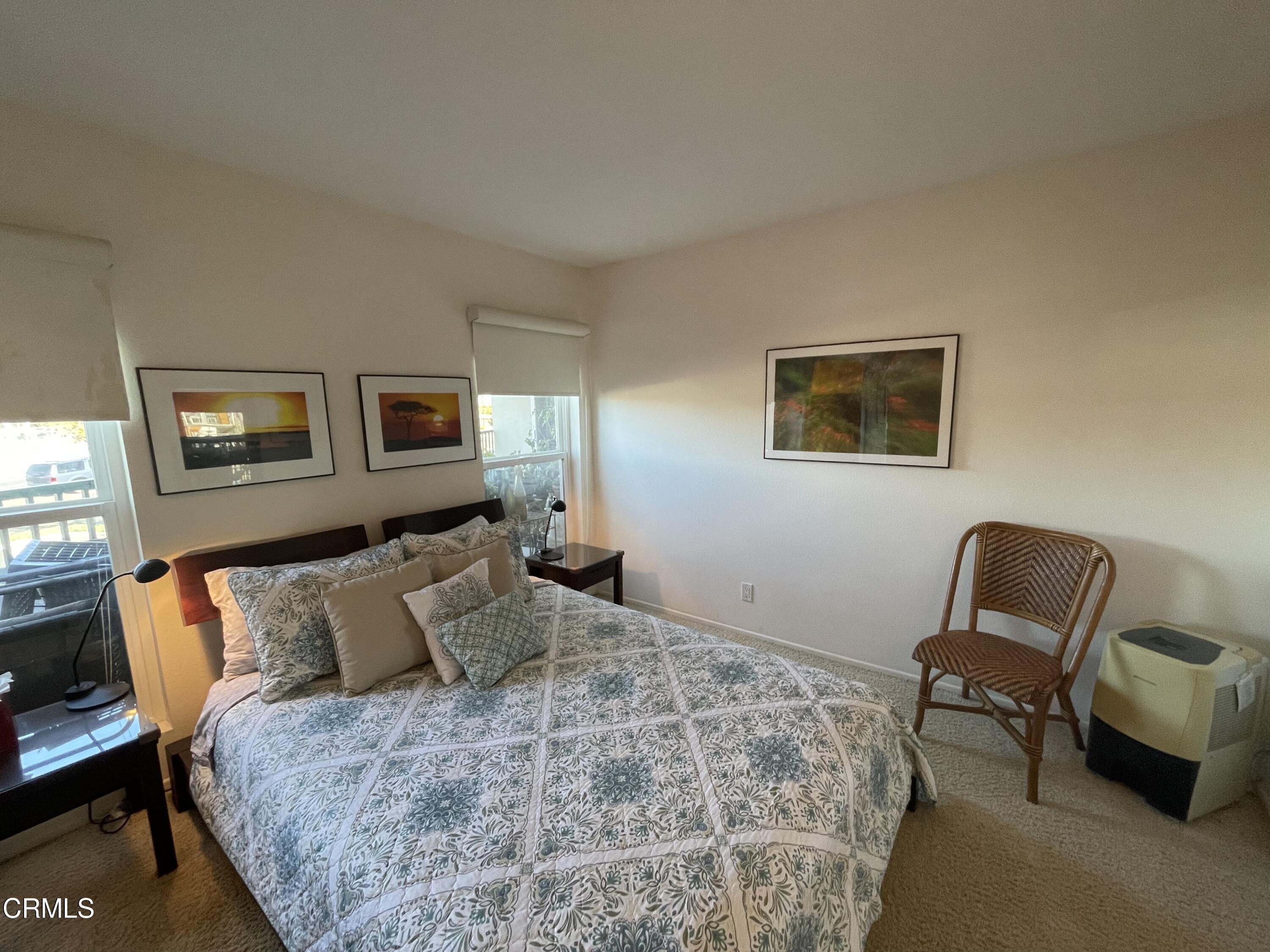 2901 Peninsula Road, Unit 144 Oxnard, CA 93035 - Photo 12 of 25 a bedroom with furniture and a window