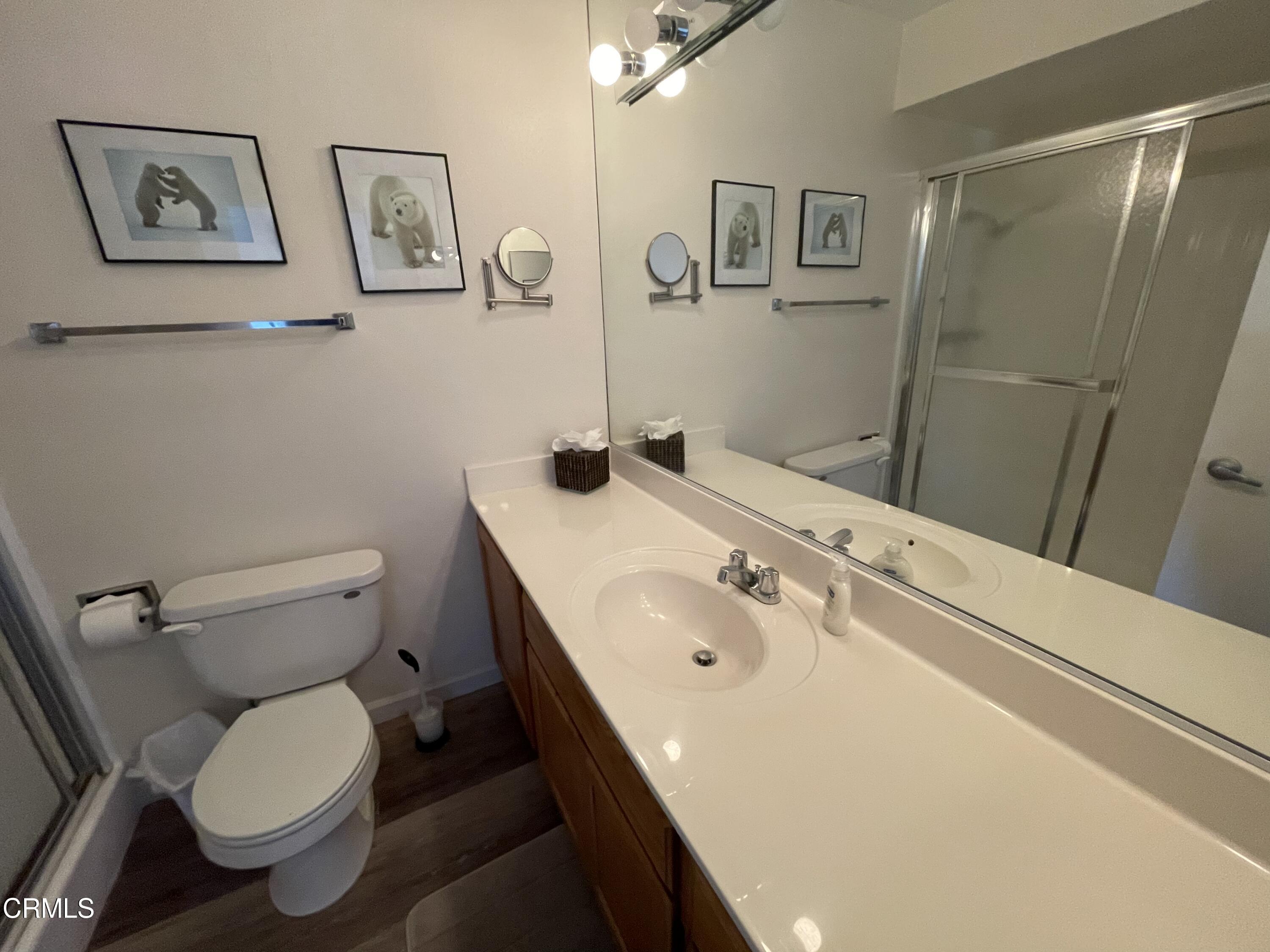2901 Peninsula Road, Unit 144 Oxnard, CA 93035 - Photo 14 of 25 a bathroom with a sink toilet and a mirror