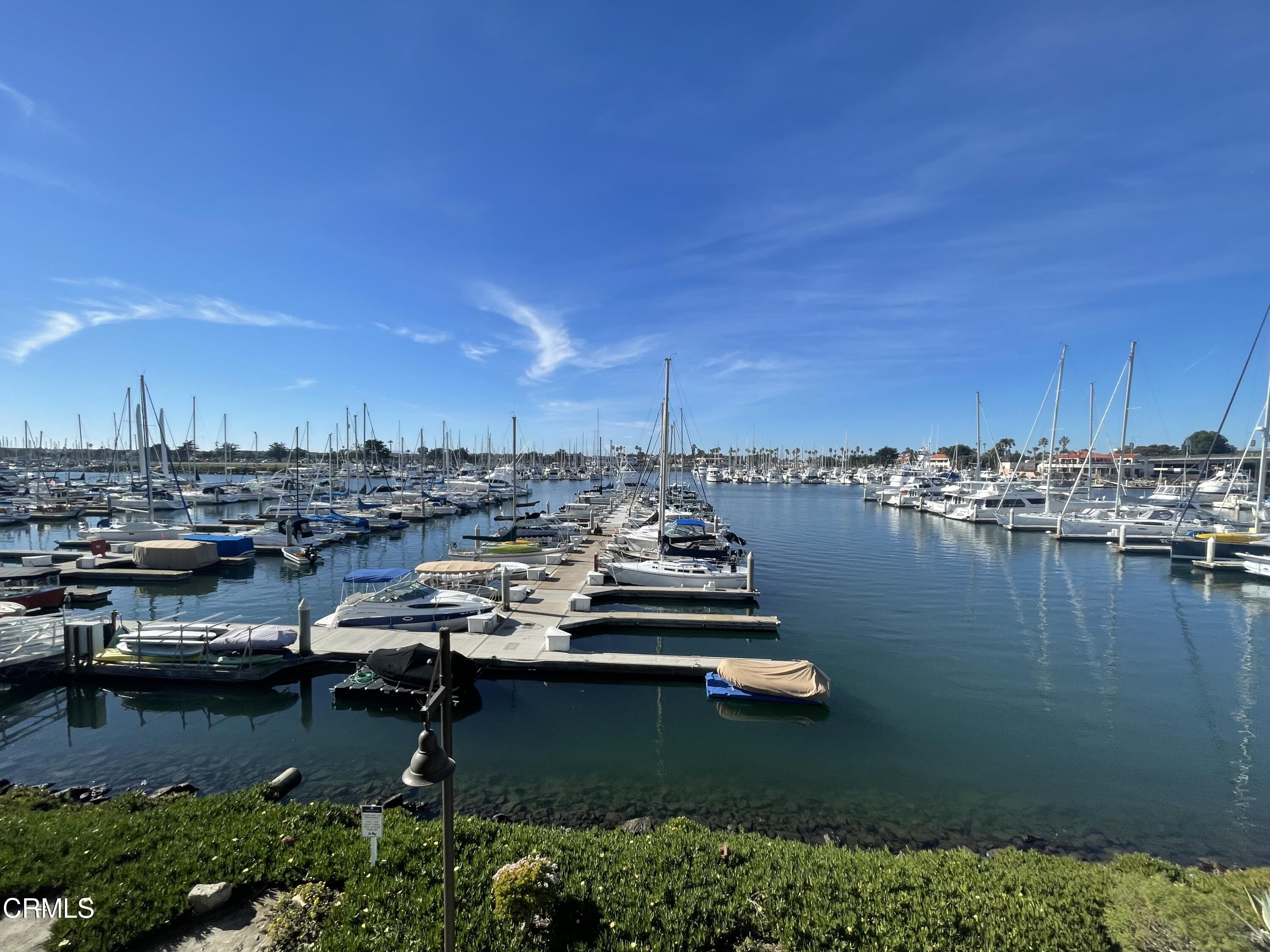 2901 Peninsula Road, Unit 144 Oxnard, CA 93035 - Photo 22 of 25 a view of a lake with boats and trees in the background